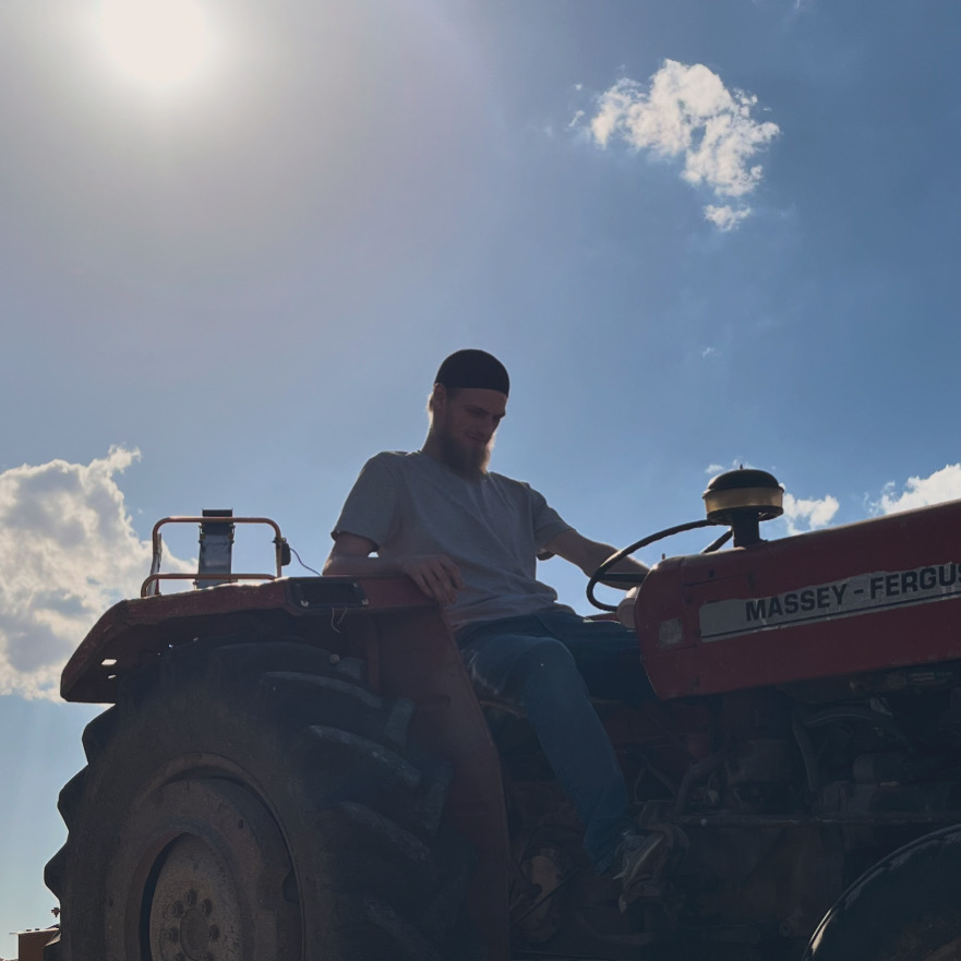 Kai on a tractor